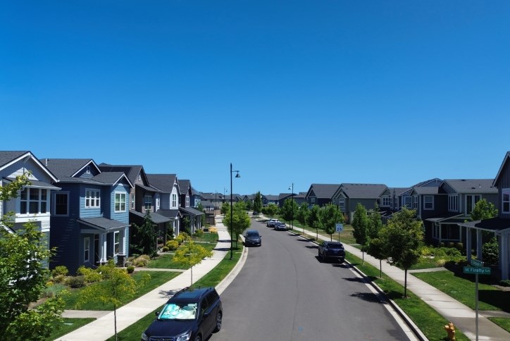 Aerial photo of new homes at Reed’s Crossing in South Hillsboro against a bright blue sky.