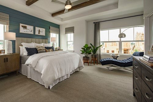 A large bedroom in a model home from David Weekley Homes at Reed’s Crossing.