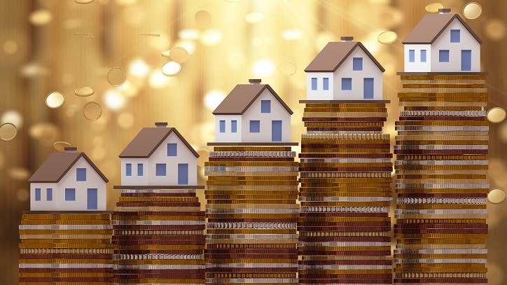 Houses on top of stacks of coins