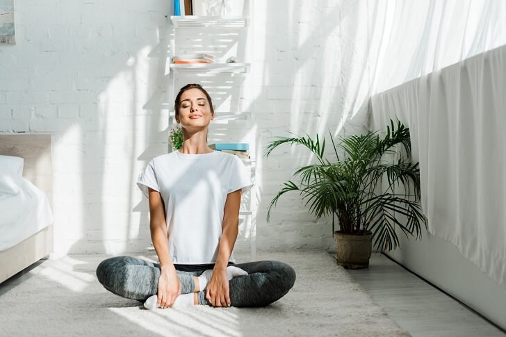 Indian Woman Meditating at Home