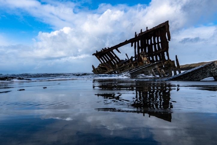 The remains of the shipwrecked Peter Iredale lie partially buried in the sand on the Oregon Coast.