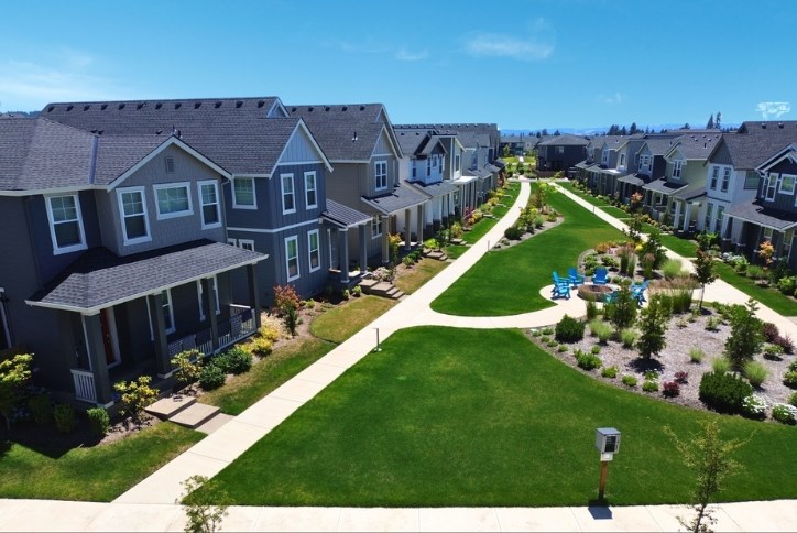 Aerial photo of Reed’s Crossing showing shared green space, a community fire pit, and a little free library.