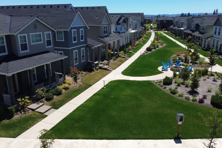 Lighted paths in Reed’s Crossing weave between new homes and a community fire pit.