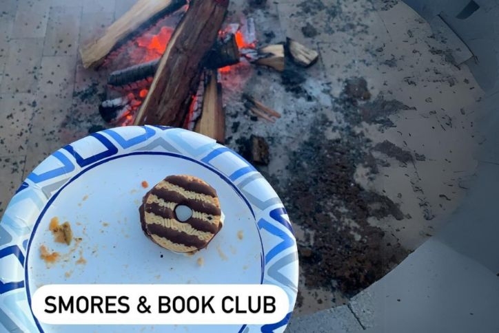 Close-up of Reed’s Crossing firepit and s'mores, posted on Instagram by the book club.