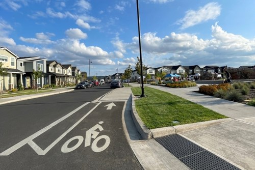 Clear road signage in Hillsboro indicates a bike path near Reed’s Crossing Park.