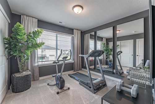 A home with flex space shows a bedroom transformed into a home gym.