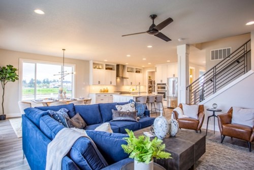 A large living room in a home for sale from Stone Bridge Homes NW at Reed’s Crossing.