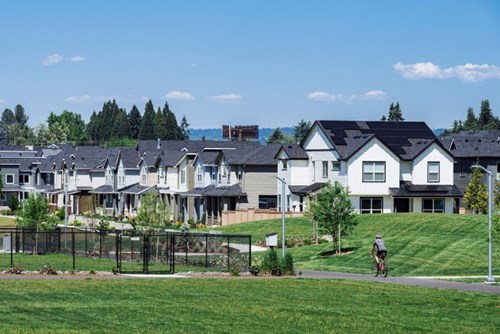 A cyclist rides along the Reed’s Crossing Greenway in Hillsboro, Oregon.