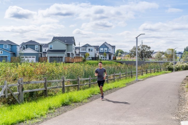 A man jogs along the Reed’s Crossing Greenway in South Hillsboro.